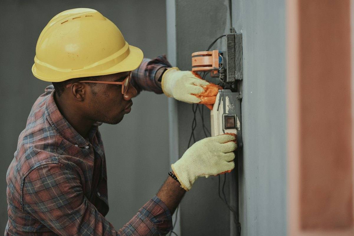 An electrician at a panel